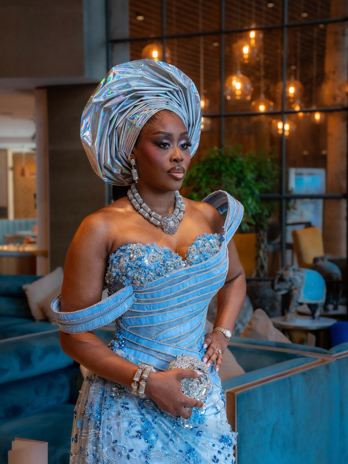 A guest in silver and ice-blue at a wedding